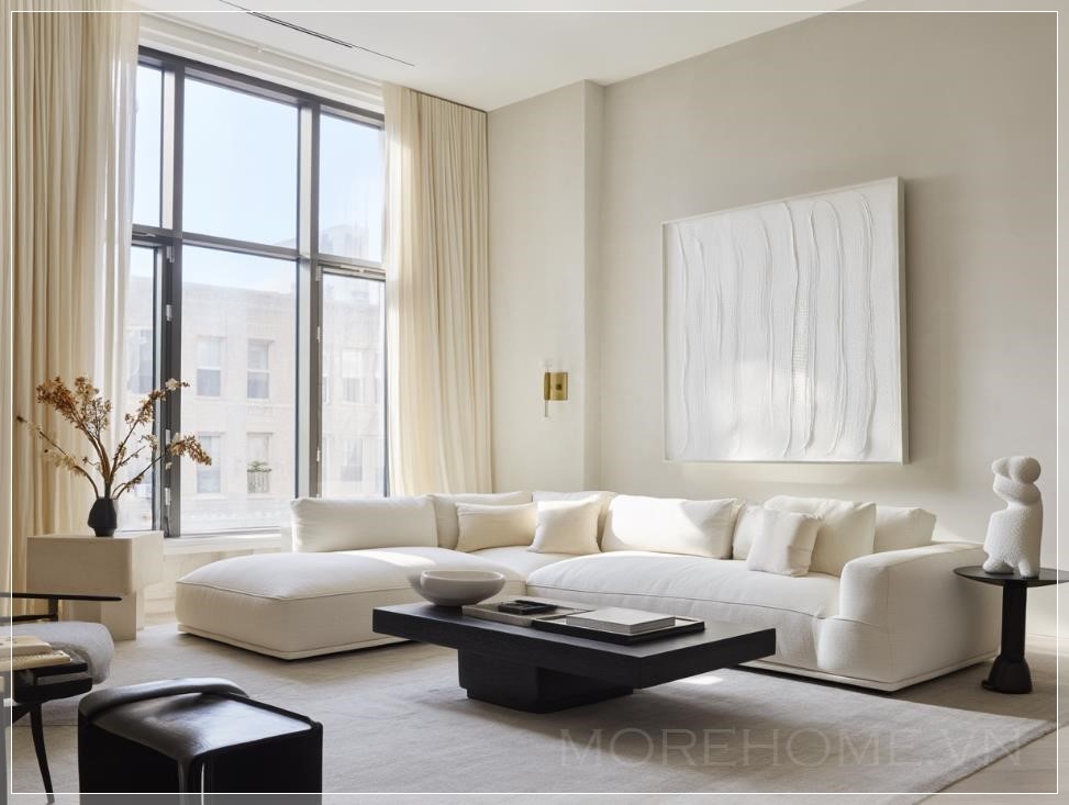 Phòng khách hiện đại, tối giản với bảng màu trung tính. Chính giữa là một bộ sofa trắng kiểu dáng thanh...